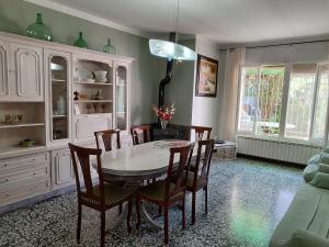 a dining room with a table and chairs at Cal Marcos in Torregrosa