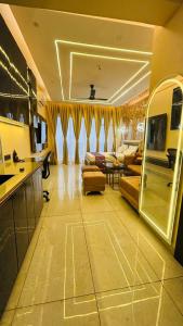 a large living room with a couch and a table at Chalo Chaley Luxury Stays in Ghaziabad