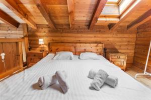 Rúm í herbergi á Chalet à Arolla 8 personnes - vue, nature & parking privé