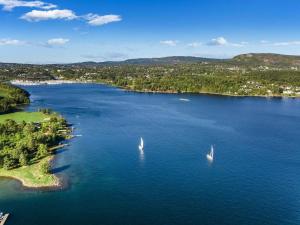 two sailboats in a large body of water at Whole Holiday Home in Asker
