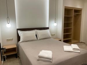 Postel nebo postele na pokoji v ubytování Tsoukos Apartments