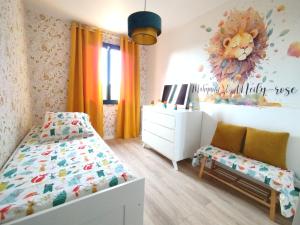 En eller flere senge i et værelse på La maison des moments