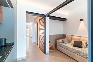 a living room with a couch and a table at Bungalow 29 PIE DE PLAYA in El Campillo del Moro