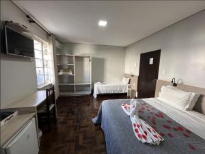 Cama o camas de una habitación en Pousada Casarão Schmidt