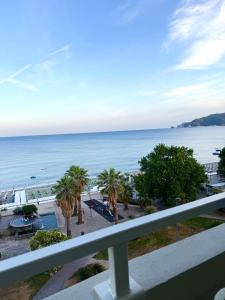 a view of the ocean from a balcony at La Finestra sul Blu - Sea View in Savona