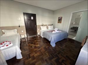 Cama o camas de una habitación en Pousada Casarão Schmidt