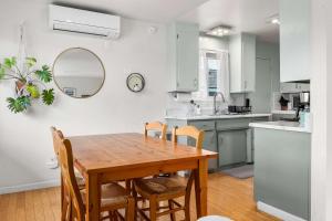 a kitchen and dining room with a wooden table and chairs at Seabright Breeze in Santa Cruz