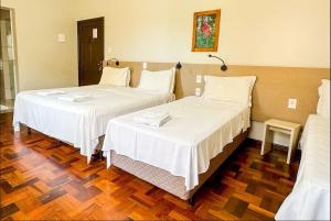 Cama o camas de una habitación en Pousada Casarão Schmidt
