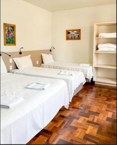 Cama o camas de una habitación en Pousada Casarão Schmidt
