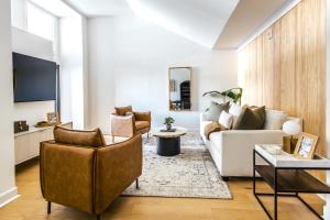 a living room with a couch and a table at 360 King in Charleston