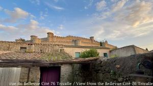 a building with a castle on top of it at Les Bellevue Cité Trivalle, Cité 500m, free private car park on demand, free public car park 200m, aircon, WIFI, Cité view terrace in Carcassonne