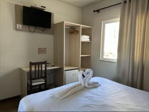 Cama o camas de una habitación en Pousada Casarão Schmidt