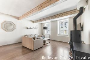 a living room with a couch and a table at Les Bellevue Cité Trivalle, Cité 500m, free private car park on demand, free public car park 200m, aircon, WIFI, Cité view terrace in Carcassonne