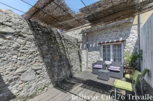 a patio with chairs and a table and a building at Les Bellevue Cité Trivalle, Cité 500m, free private car park on demand, free public car park 200m, aircon, WIFI, Cité view terrace in Carcassonne