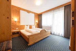 Posteľ alebo postele v izbe v ubytovaní Aparthaus Camping Stubai