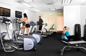 a group of people exercising on treadmills in a gym at Handlery Union Square Hotel in San Francisco