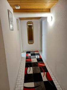 a hallway with a checkered floor in a room at Guest house in Datteln 2 in Datteln