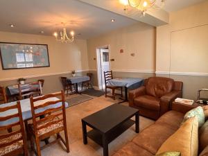 a living room with a couch and a table at The Mayfair guest house self catering in Southampton
