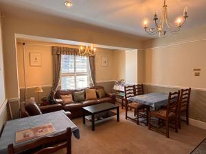 a living room with a couch and a table at The Mayfair guest house self catering in Southampton