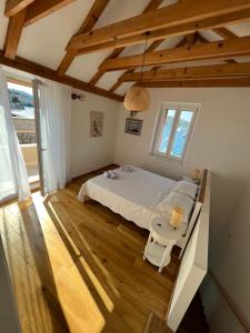 a bedroom with a bed and a table in it at Sea house Škapulo in Vis