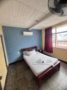 Ένα ή περισσότερα κρεβάτια σε δωμάτιο στο hotel dorado