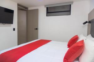 Postel nebo postele na pokoji v ubytování ApartaHotel Estadio