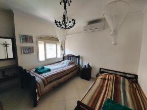 Postel nebo postele na pokoji v ubytování Telal Compound Ain EL Sokhna Sea and pool Villa + 7 fotografií