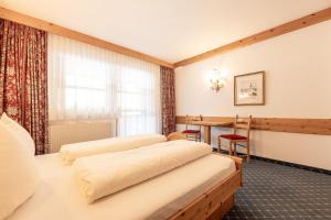 Posteľ alebo postele v izbe v ubytovaní Aparthaus Camping Stubai