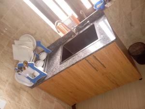 an overhead view of a bathroom with a toilet and sink at Luxury 2 Bedroom Flat at Independence Layout in Enugu