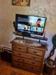 a flat screen tv sitting on top of a dresser at CASA PABLITO in San Bartolomé