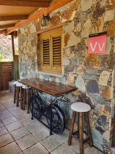 a bike parked in front of a stone wall at CASA PABLITO in San Bartolomé