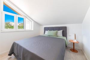 Ένα ή περισσότερα κρεβάτια σε δωμάτιο στο Rudina Apartment near Dubrovnik with free parking