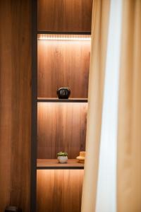 a cupboard with a plant in a bowl on it at Sonrisa Apartments Kolasin in Kolašin