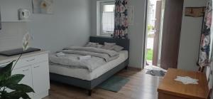 En eller flere senge i et værelse på Zielone Tarasy