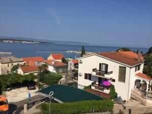 an aerial view of a house with a swimming pool at Apartments Antonia in Malinska