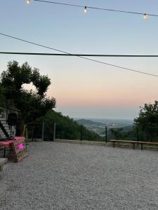 a bench sitting on top of a hill with a view at Casa Borgo Pietro in Galzignano +6 photos