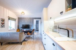 a kitchen with a large tub in a room at Unique city center Apartments Gran Fenice with free garage parking and roof terrace in one of the apartments in Rijeka