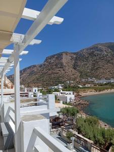a view of the beach from the balcony of a house at Armiriki Seaside in Kamarai