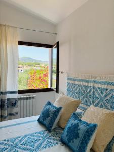Ένα ή περισσότερα κρεβάτια σε δωμάτιο στο La Pavoncella