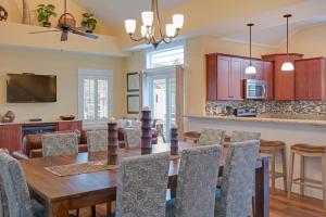 a dining room and kitchen with a table and chairs at Seaside Serenity in Corolla +38 photos
