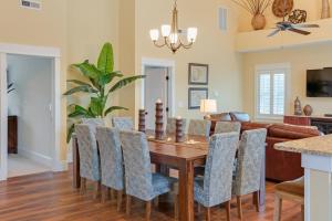 a dining room with a wooden table and chairs at Seaside Serenity in Corolla