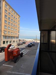 a view of a street from a building with a beach at Studio Nacre Knokke in Knokke-Heist
