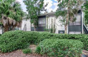 a house with trees and bushes in front of it at The Trails K256 I Spacious And Comfy 1 Bed 1 Bath in Gainesville