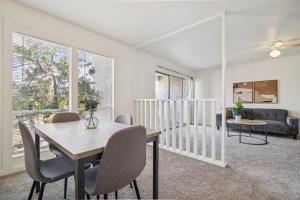 a living room with a table and chairs and a couch at The Trails K256 I Spacious And Comfy 1 Bed 1 Bath in Gainesville