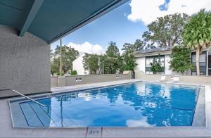 a swimming pool with blue water in a house at The Trails M262 I Spacious 2 Bed 2 Bath in Gainesville