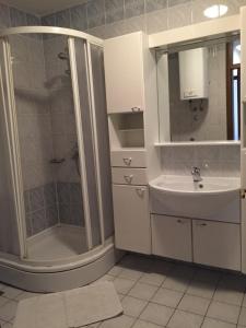 a bathroom with a shower and a sink at Apartments Antonia in Malinska +99 photos