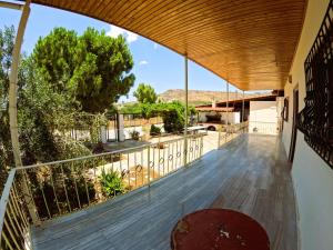 a balcony with a view of the desert at Meraki House Kalamaki in Kalamáki