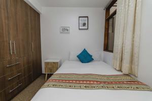 Postel nebo postele na pokoji v ubytování Cozy Room Cusco