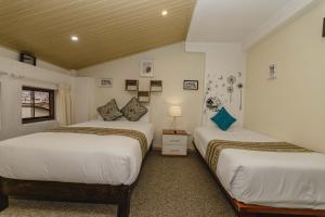 Postel nebo postele na pokoji v ubytování Cozy Room Cusco
