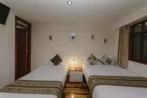 Postel nebo postele na pokoji v ubytování Cozy Room Cusco